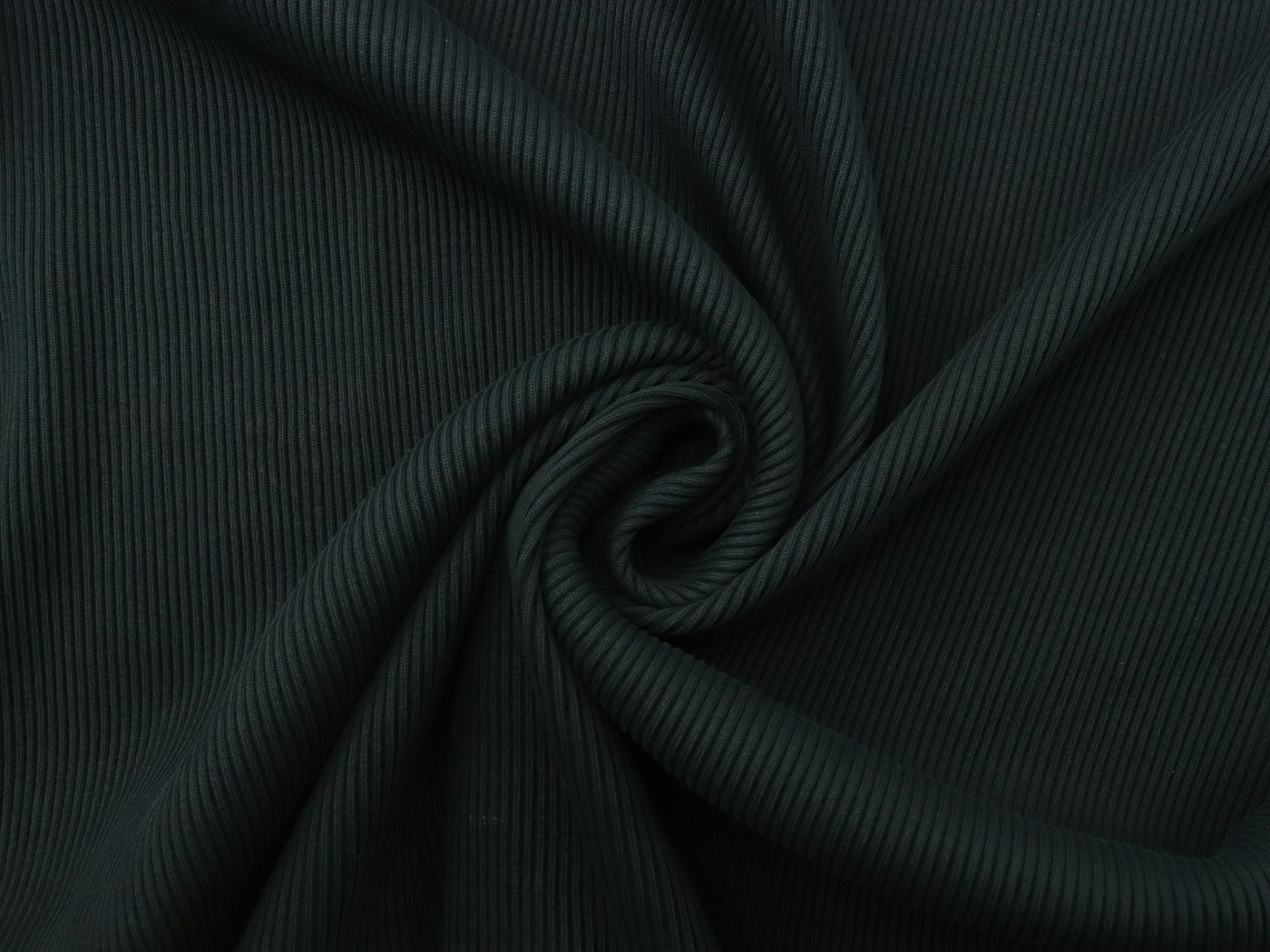 Dark ribbed knit fabric folded into a swirl