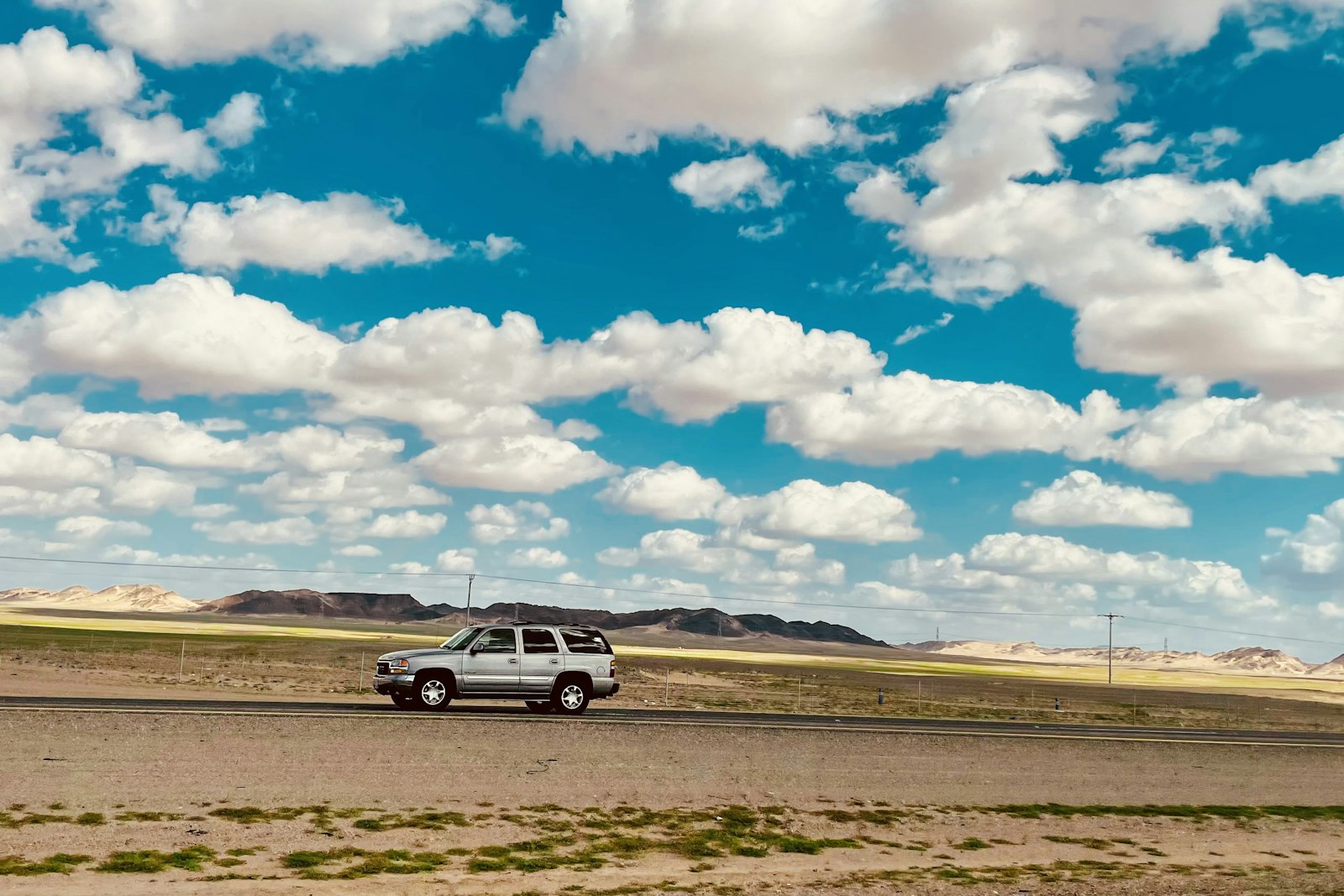 Open‑pit gold mining scene in the Makkah desert with excavators and haul trucks