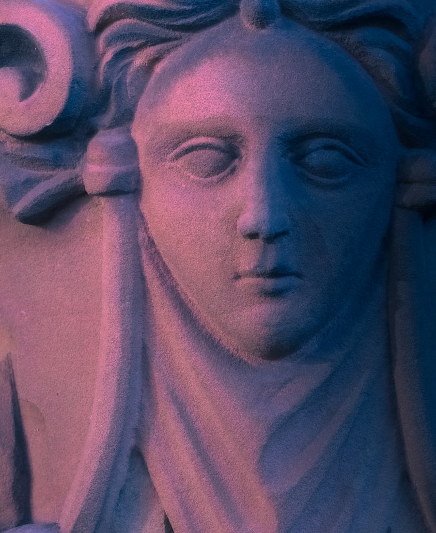 Classical marble statue under a crescent moon
