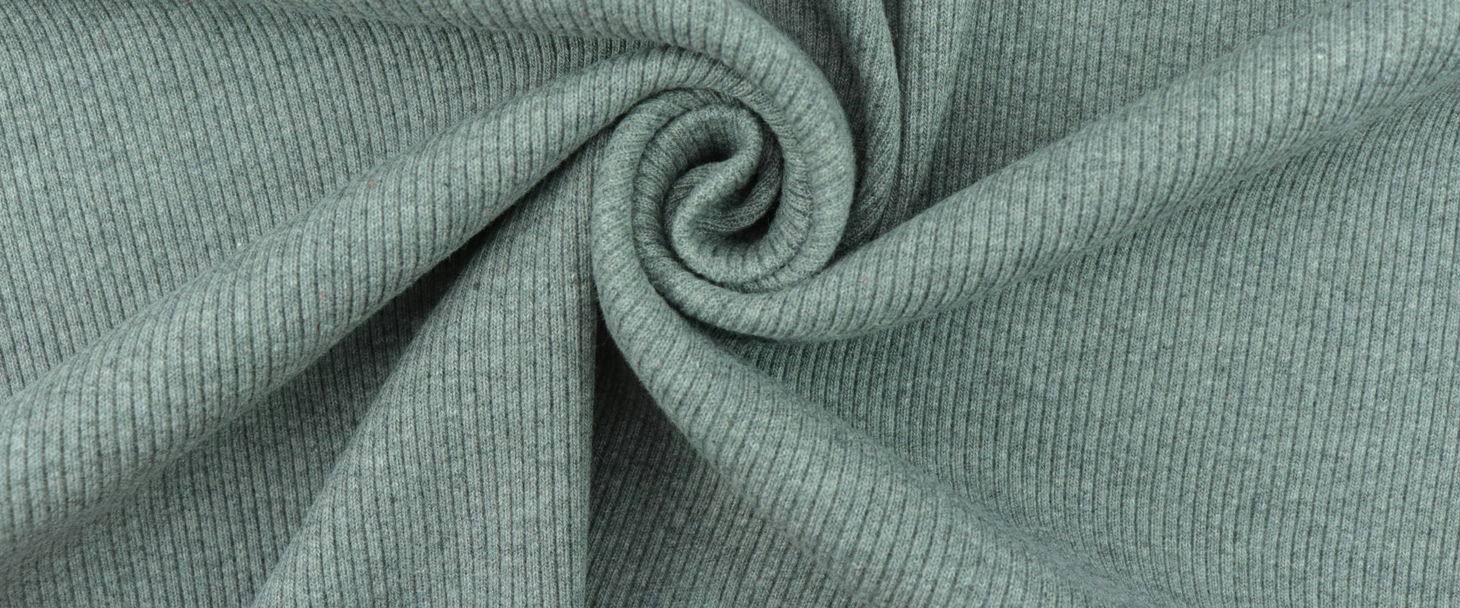 Ribbed knit fabric drawn into a soft spiral