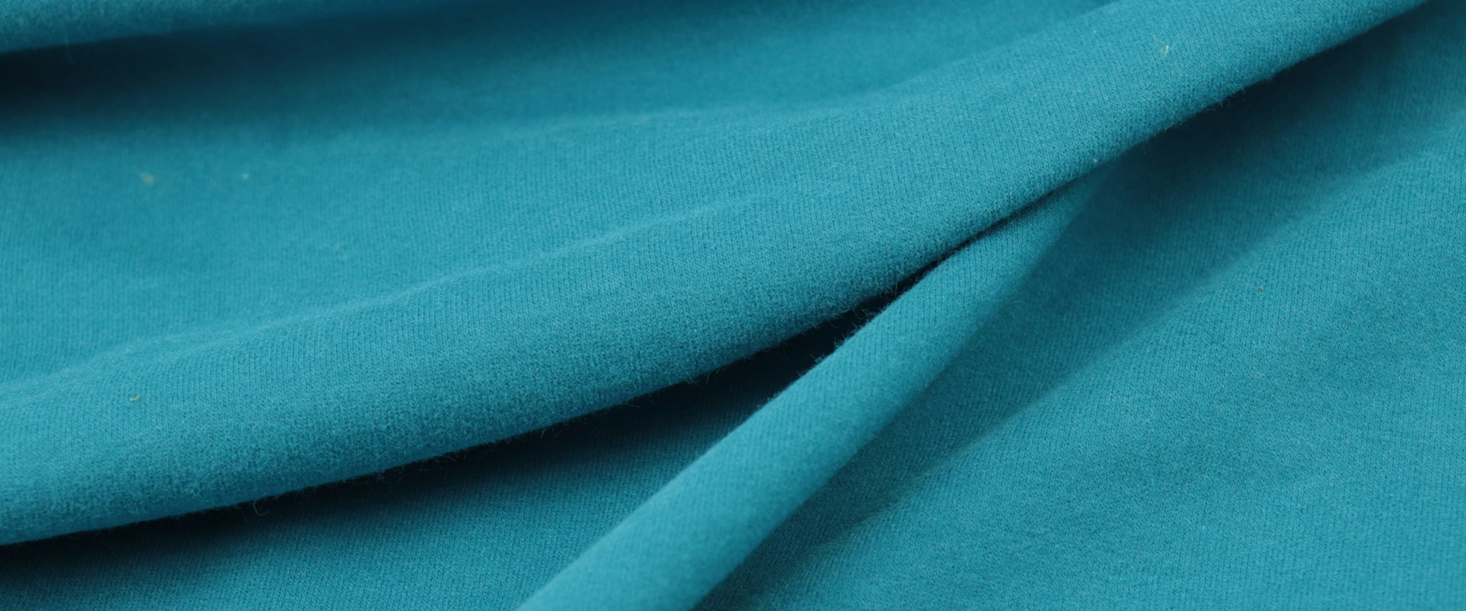 Folds of a smooth technical knit fabric