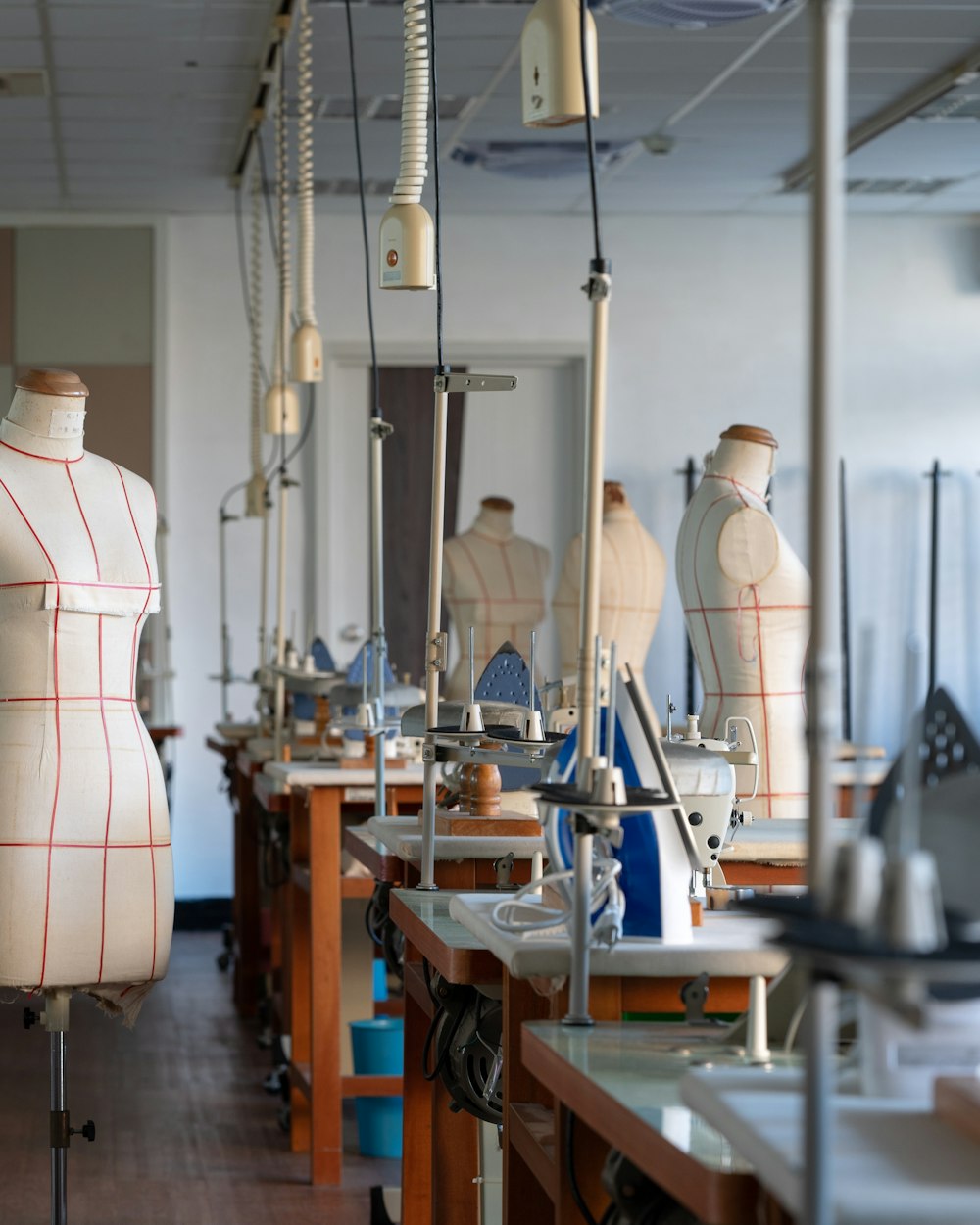 The production floor that holds cutting, printing, sewing, embroidery, finishing, and packing under one roof