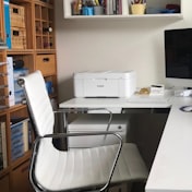 Founder at desk using laptop in co-working space