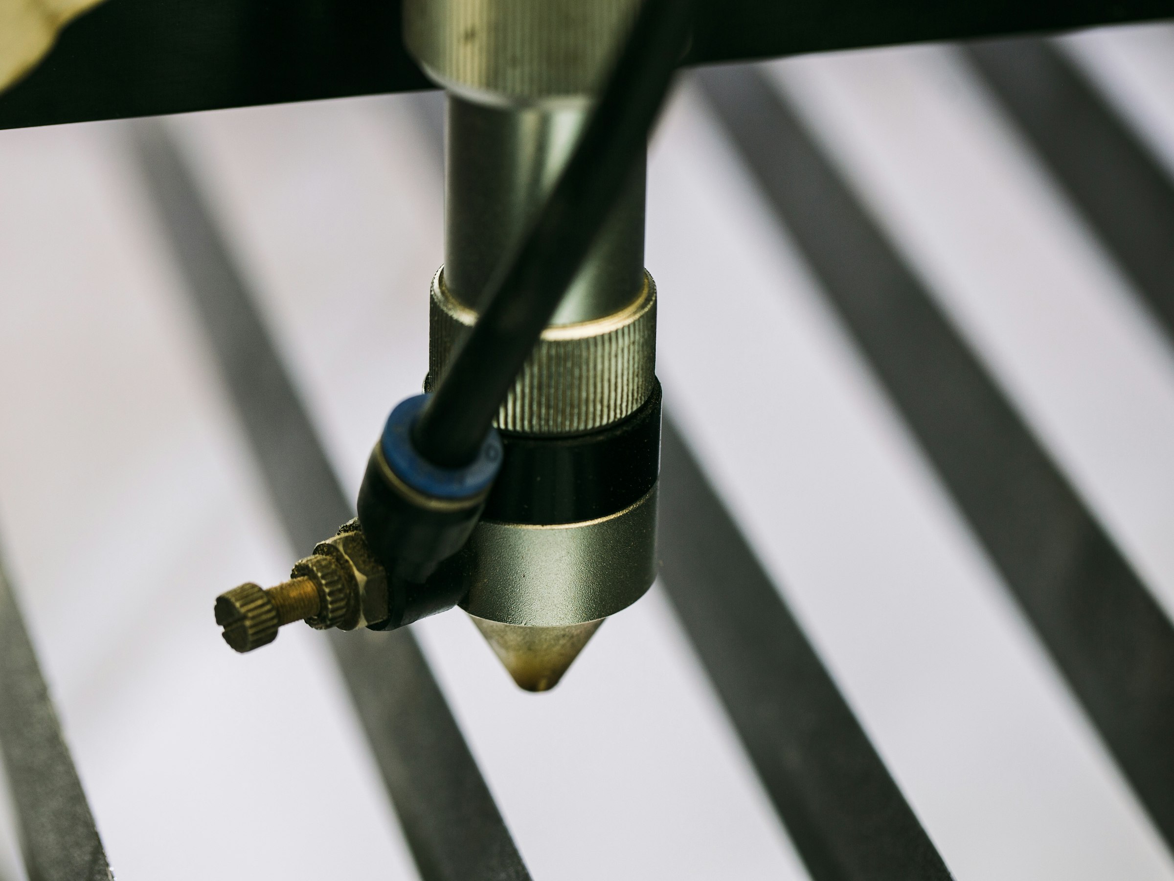 Laser micro welding machine welding a small precision part under a microscope