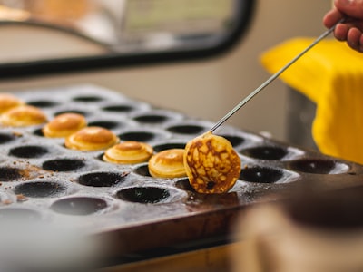 Assorted baking tools with pastel macarons