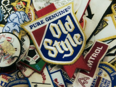 Multi-layer tackle twill crest with three stacked colors and multiple stitched borders