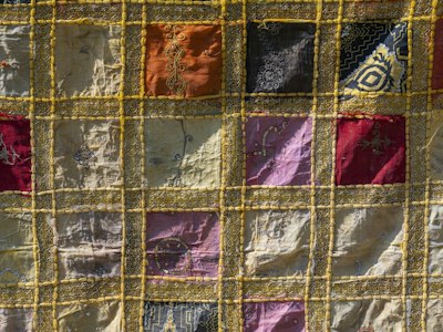Two-layer tackle twill number with a main color and a contrasting border layer