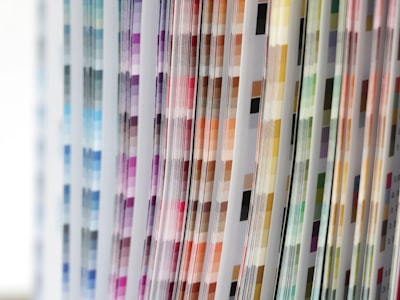 Lab technician testing cycling fabric stretch, GSM and colorfastness