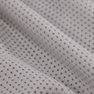 Close-up of polyester mesh knit structure used for hockey jersey vent panels