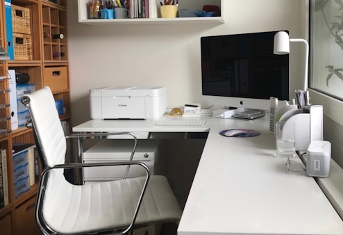 Founder at desk using laptop in co-working space