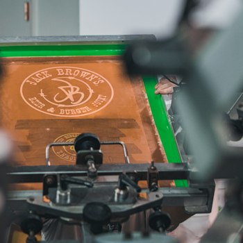 Heat transfer close-up: a name and number being pressed onto a jersey back
