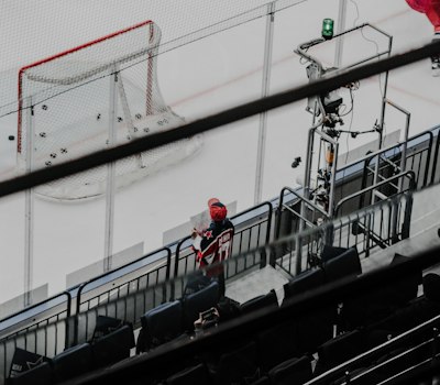 Youth players in game jerseys during a face-off