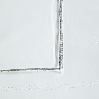 Tackle twill close-up: layered twill numbers with zigzag stitching
