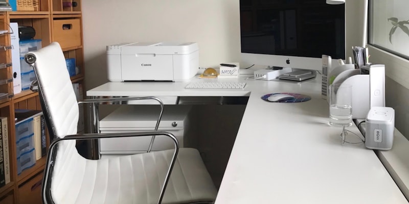 Founder at desk using laptop in co-working space