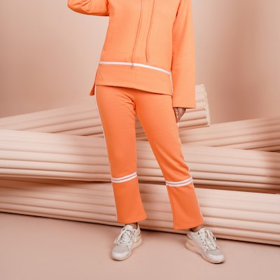 Warm-up jacket and matching pants worn together as a team tracksuit