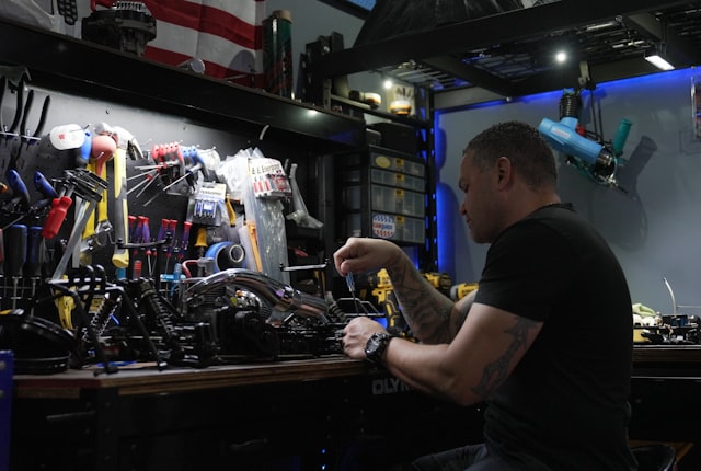 Distributor evaluating a jewelry laser welder on a workbench