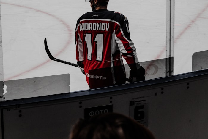 A full hockey uniform laid out together: jersey, socks, and pant shell in one fictional colorway