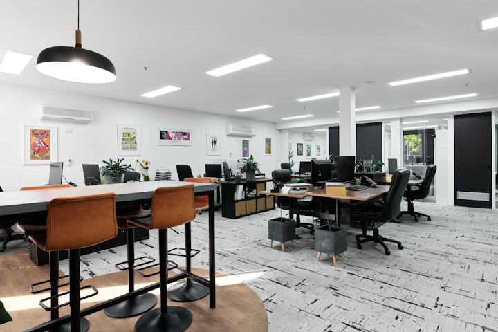 Students collaborating with laptops