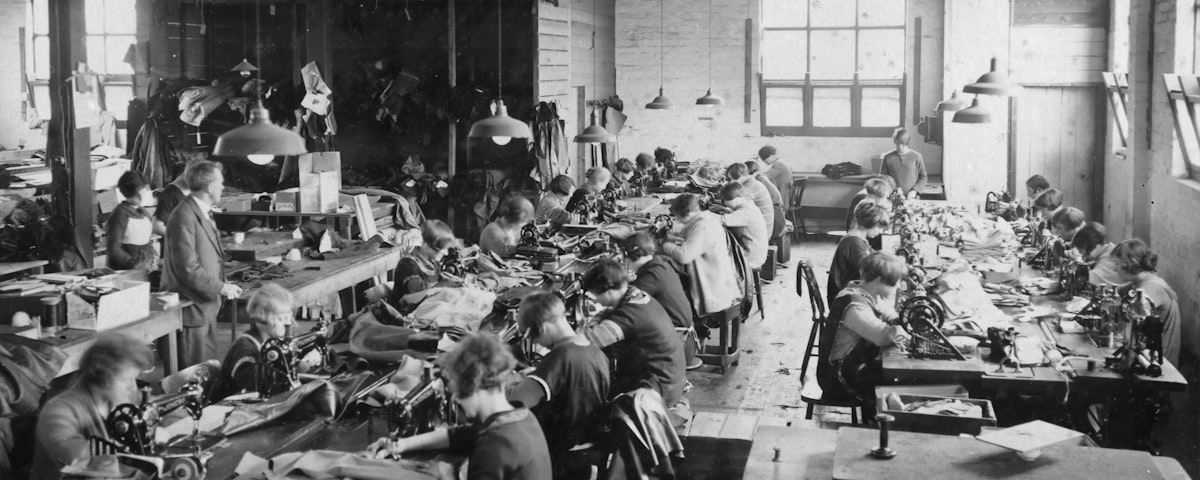 Factory production floor overview — multiple workstations in operation