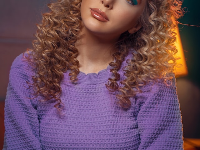 Woman wearing a chic short bob wig in professional setting