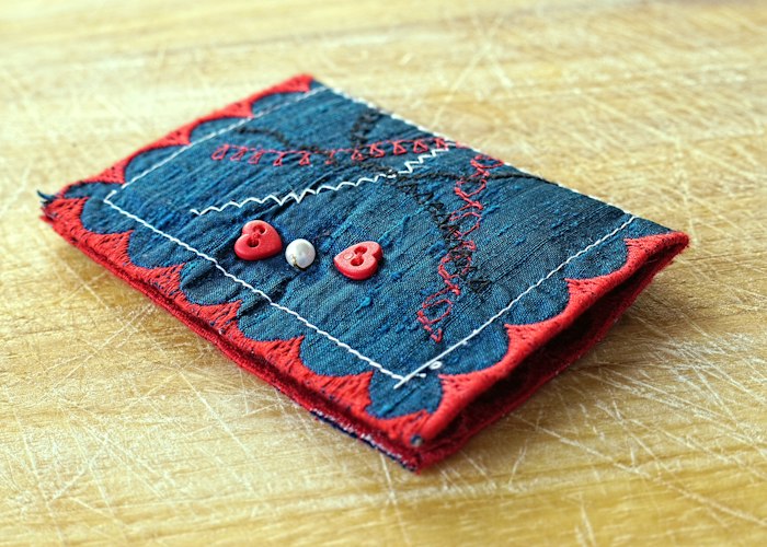 Decoration sample panel with a sewn twill crest, a layered number and an embroidered logo ready for approval