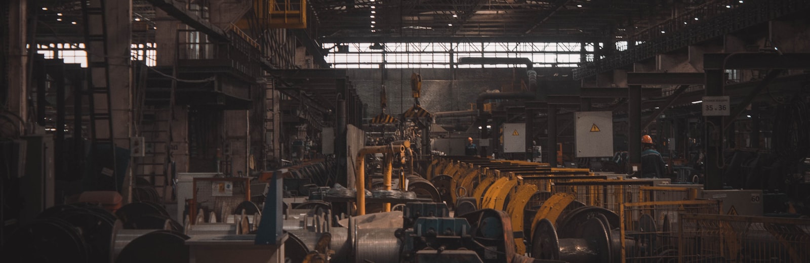 Wall printer production line and in-house parts shelves — the factory-direct chain behind a financed machine