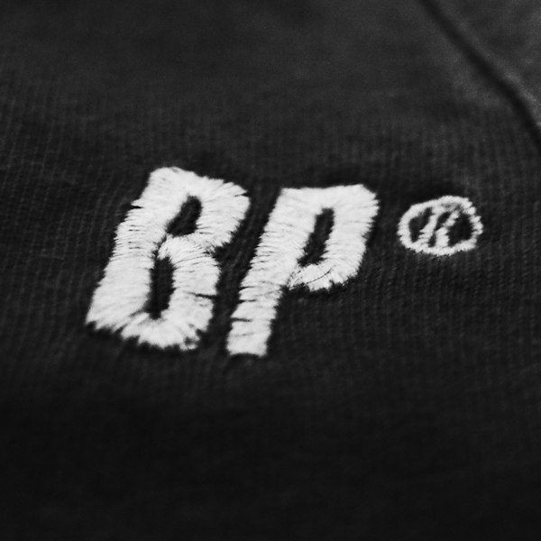 Close-up of embroidered crest and tackle twill number on a hockey jersey