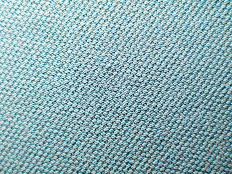 Double-knit polyester — the heavier, denser build for practice jerseys