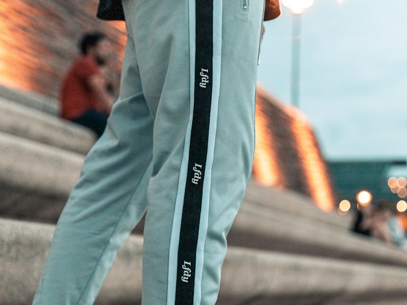 Folded hockey pant shells in two different colorways stacked for a mid-season reorder