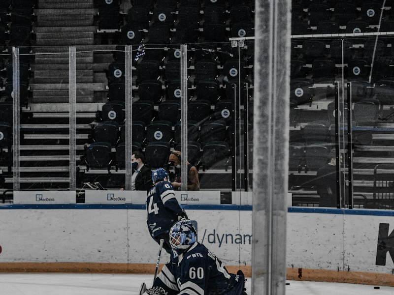 Goaltender on a women's team wearing a roomier goalie cut jersey over chest protector