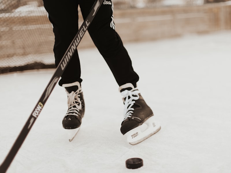 Hockey practice shells in a bright orange group color worn at a training session