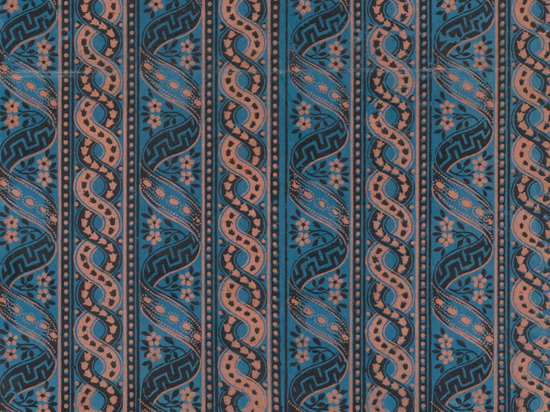 Engineered stripes sublimated into flat hockey sock fabric at a diagonal angle in royal blue and white