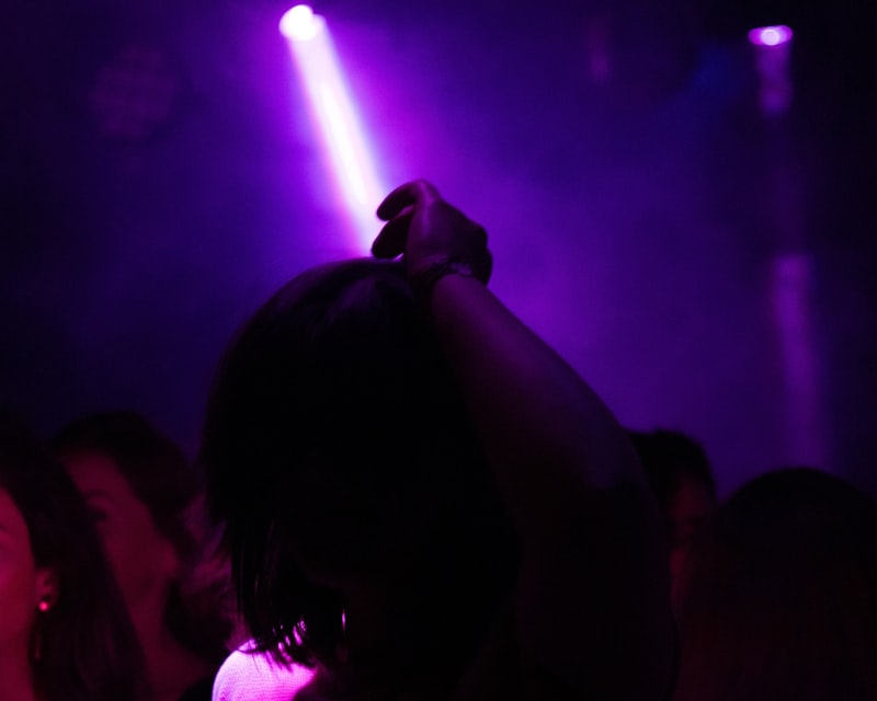Ava Knight, female DJ performing with neon lights