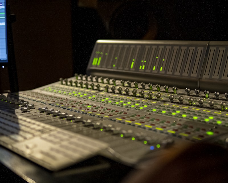 Mateo Cruz, male producer in studio at mixing console