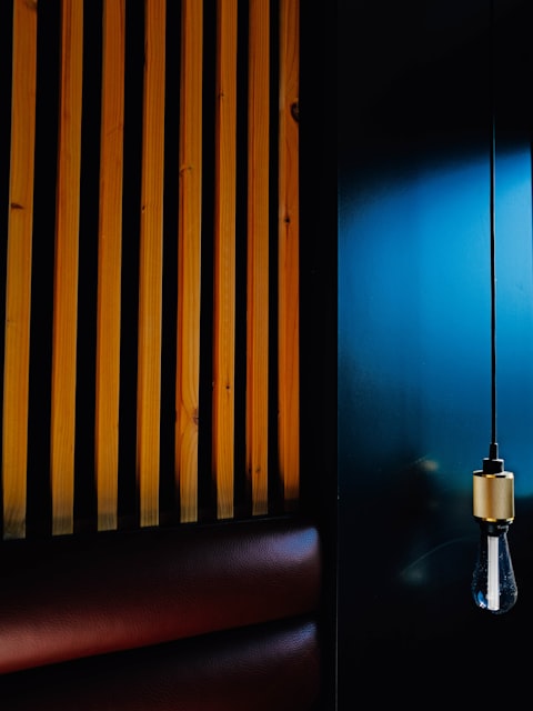 Singer in a recording booth with colorful lights