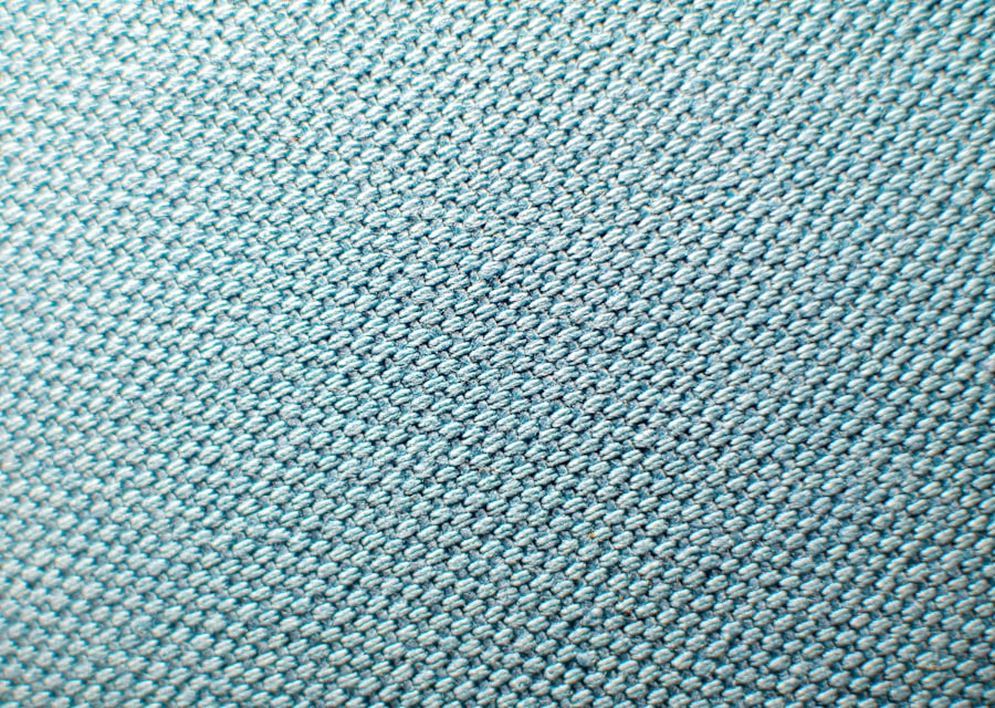 Factory pattern blocks and fabric swatches behind an ODM hockey jersey program