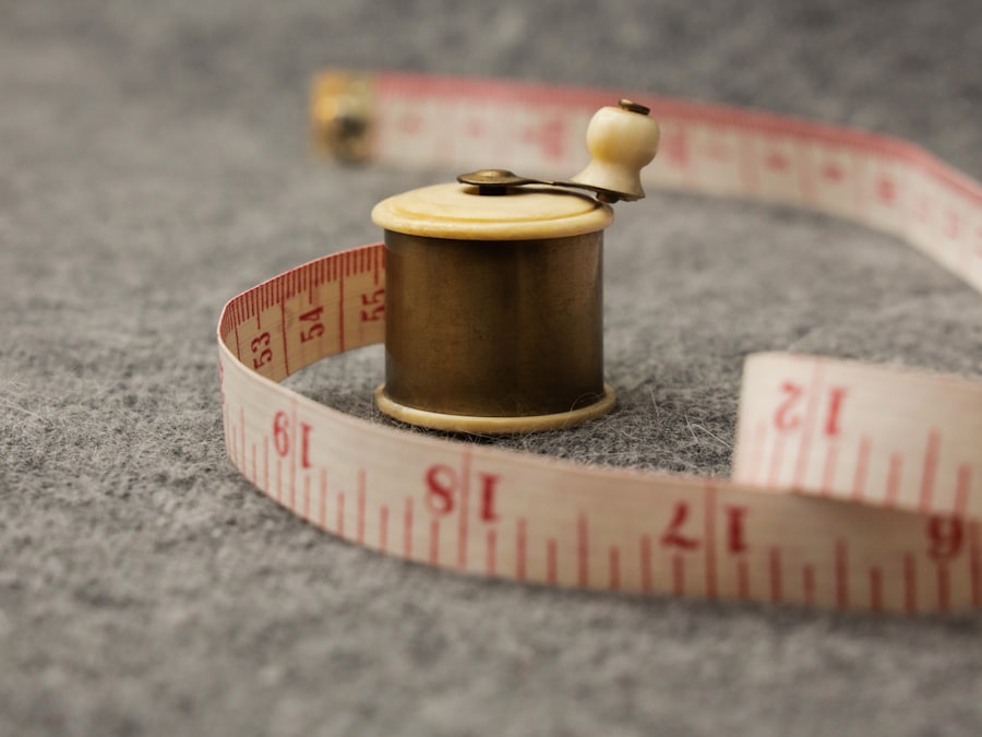 A tape laid across a garment on a flat worktable — every point on this page is measured flat, never on a body