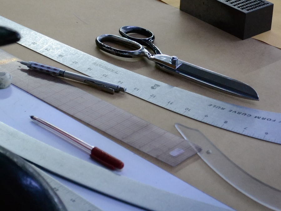 A tailor's worktable with measuring tools — on-body measurement is the fallback when no reference garment exists