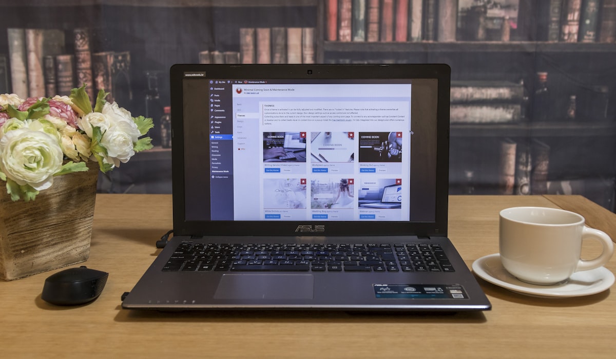 Minimal workspace with laptop and notebook