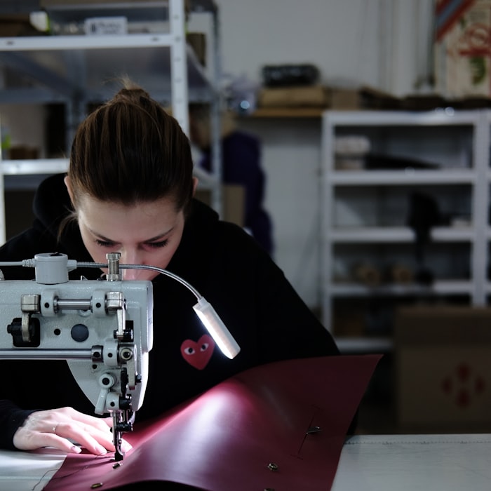 A private-label first style on the line — the brand's own main label and hangtag, invented marks