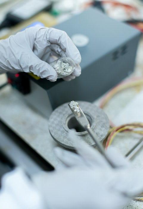 Electronic heating assembly — technician assembling heating elements onto fabric