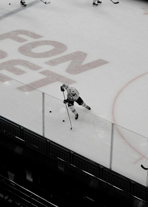 Player wearing a Women's Cut hockey jersey, shaped through chest and waist with a shorter body length