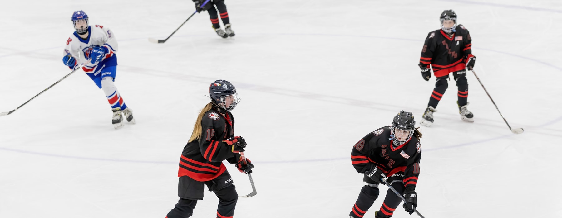 Neutral document tabs and unbranded ice hockey apparel details as supplier-research navigation cues
