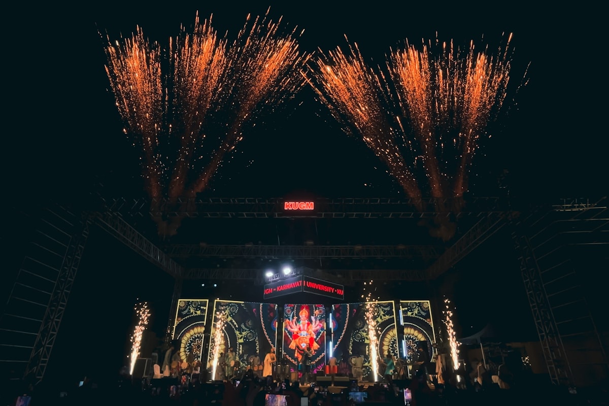 Festival crowd at night with fireworks