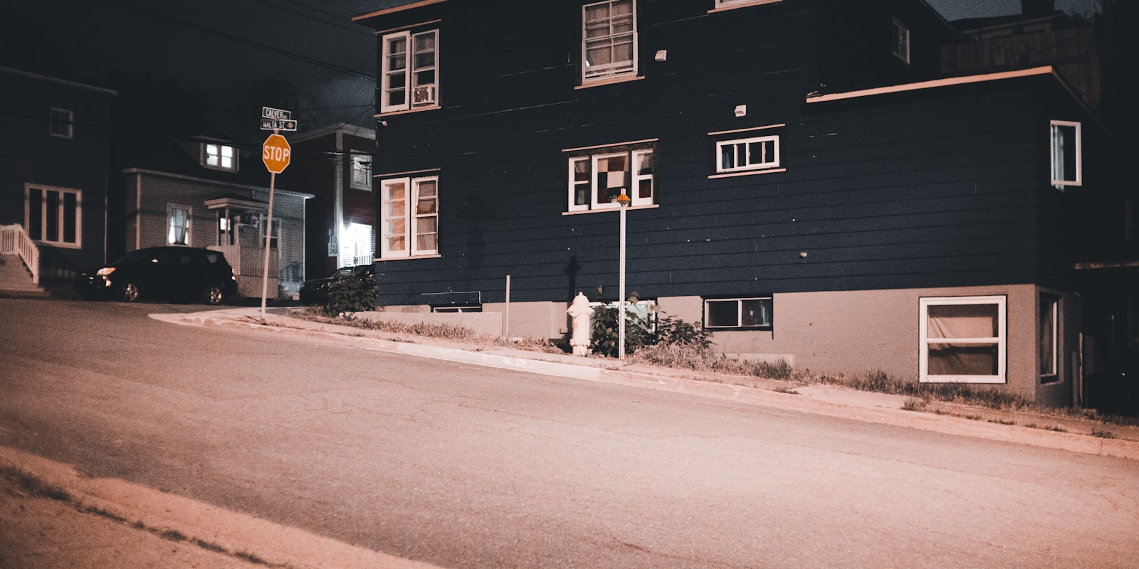 Roofing crew working on a roof at dusk