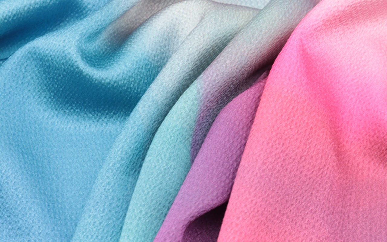 The same polyester fabric stock used for both the sample and the bulk run that follows it