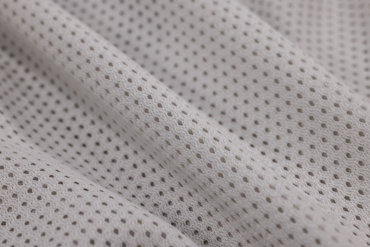 Mesh polyester close-up — the ventilation panel fabric a first order can run on