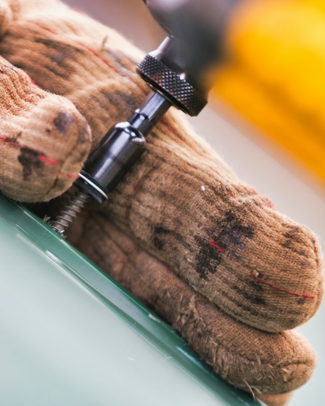 Pen pocket with a marker clipped on a khaki work shirt