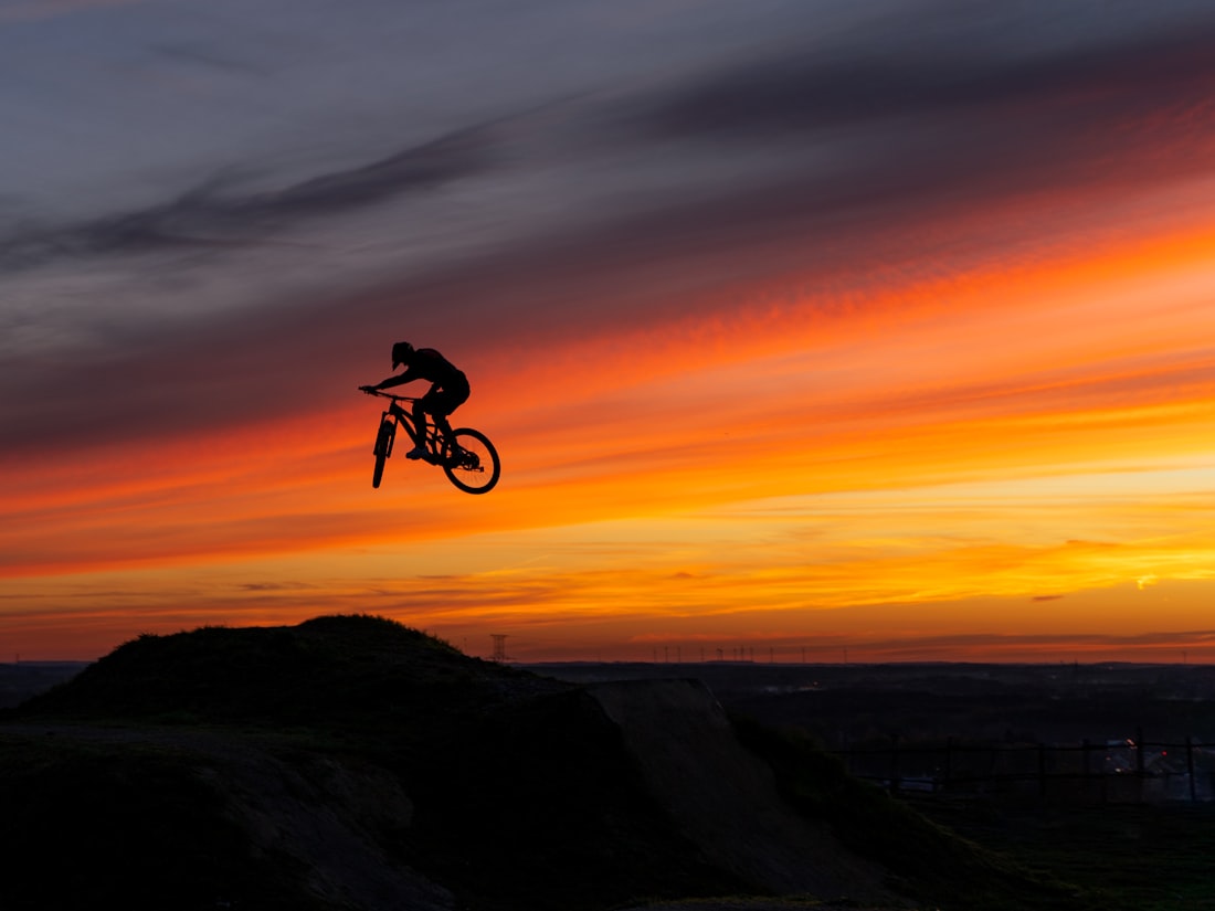 Mountain biker riding a technical off-road trail