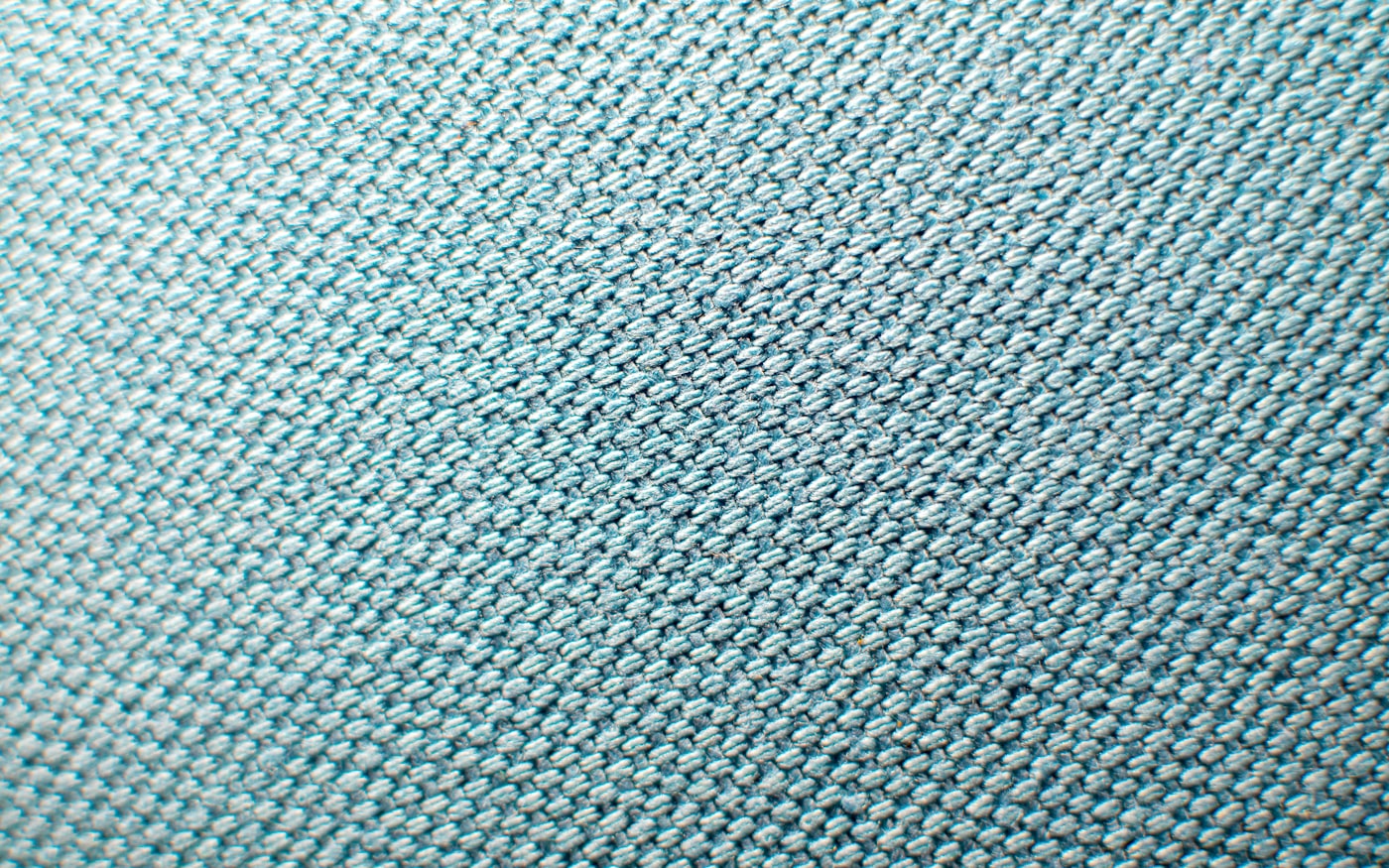 Two fabric swatches, mesh and laminate, side by side for comparison